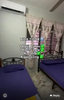 a room with two beds and a window with words at D' Gerik Homestay Taman Sinaran in Gerik