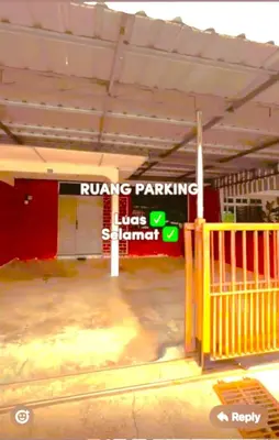 a building with a parking sign in front of it at D' Gerik Homestay Taman Sinaran in Gerik
