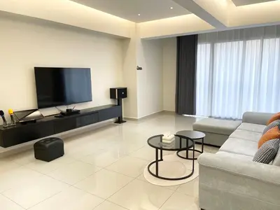 a living room with a couch and a flat screen tv at CozyNest Homestay The venus Sitiawan Sing & Play in Seri Manjung
