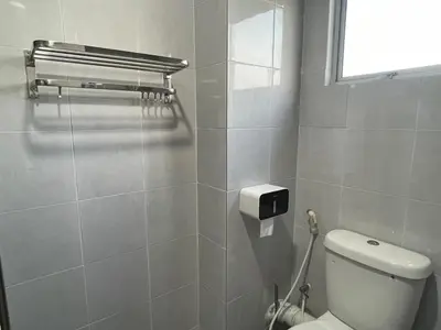 a bathroom with a toilet and a window at CozyNest Homestay The venus Sitiawan Sing & Play in Seri Manjung