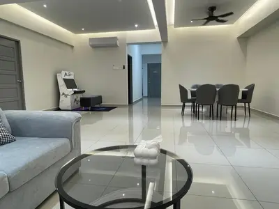 a living room with a couch and a table at CozyNest Homestay The venus Sitiawan Sing & Play in Seri Manjung