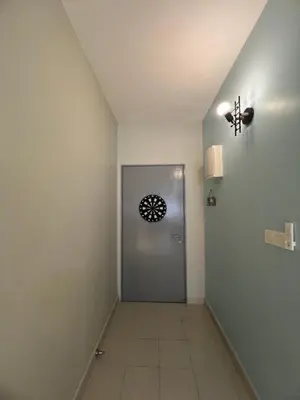 a hallway with a door and a tile floor at SweetHome in Ipoh
