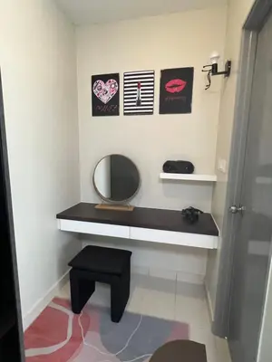 a bathroom with a vanity with a mirror and a stool at SweetHome in Ipoh