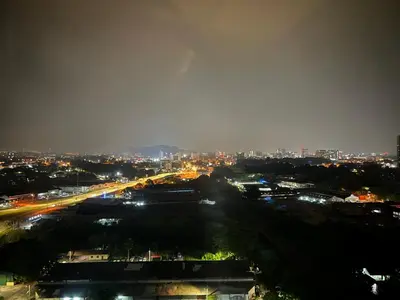 a view of a city at night with lights at SweetHome in Ipoh