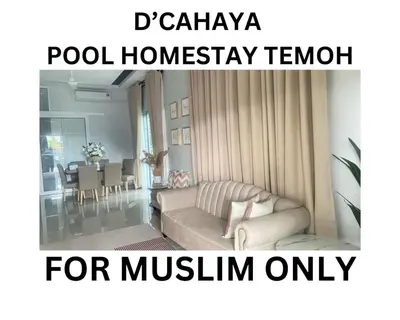 a living room with a couch and a dining room at D Cahaya Homestay in Tapah