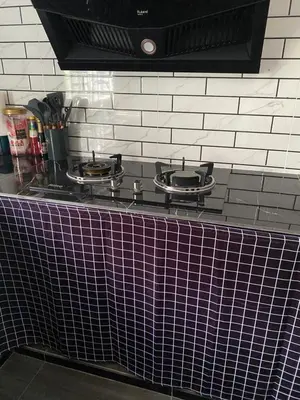 a kitchen counter with two burners on a stove top at D Cahaya Homestay in Tapah