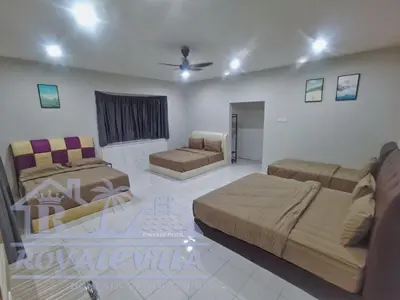 a living room with two beds and a couch at Royale Villa Private Pool Batu Gajah Ipoh Perak in Batu Gajah
