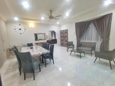 a dining room with a table and chairs and a clock at Royale Villa Private Pool Batu Gajah Ipoh Perak in Batu Gajah