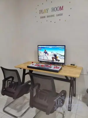 a desk with a computer on top of it at Royale Villa Private Pool Batu Gajah Ipoh Perak in Batu Gajah