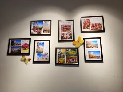a group of pictures on a wall at Ipoh 168 Taman Pelangi, Persiaran Halaman Ampang Ipoh Homestay in Ipoh