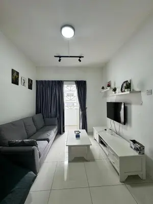 a living room with a couch and a tv at AYAAN BLOSSOM BUDGET HOMESTAY FREE WiFi and Netflix in Tanah Rata
