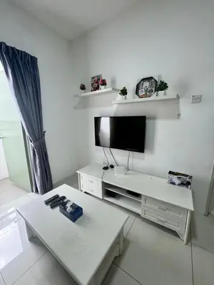 a living room with a flat screen tv on the wall at AYAAN BLOSSOM BUDGET HOMESTAY FREE WiFi and Netflix in Tanah Rata