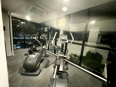 a row of cardio exercise bikes in a gym at 3BR apartments 10pax george town netflix in Jelutong