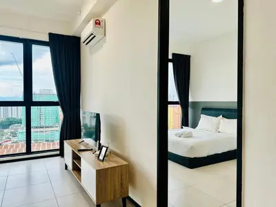 a bedroom with a bed and a large window at 3BR apartments 10pax george town netflix in Jelutong