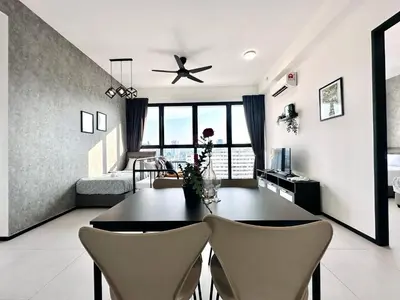 a living room with a dining room table and chairs at 3BR urban suites 8-10pax luxury family stay netflix in Jelutong