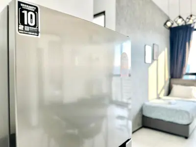 a room with a room with a bed in it at 3BR urban suites 8-10pax luxury family stay netflix in Jelutong