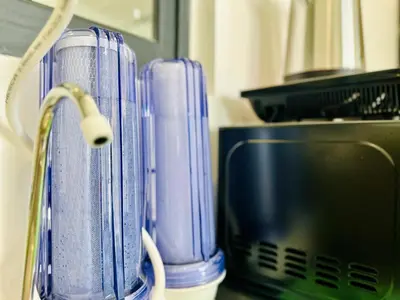 a couple of blue containers sitting next to a computer at 3BR urban suites 8-10pax luxury family stay netflix in Jelutong