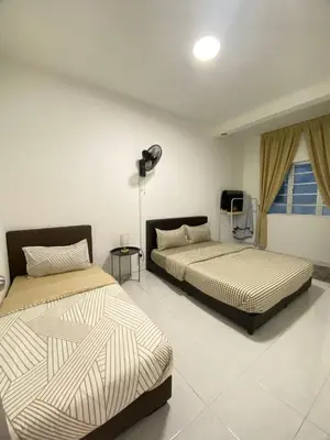 a bedroom with two beds and a window at Daddy Homes3 Emerald Centrum Brinchang Cameron Highlands sunset view in Brinchang