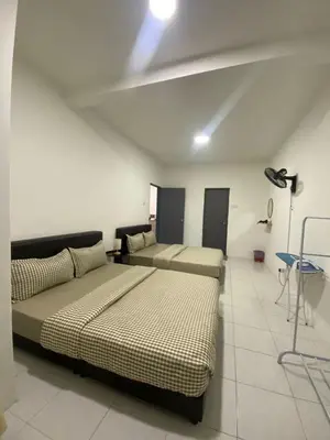 a room with two beds and a couch in it at Daddy Homes3 Emerald Centrum Brinchang Cameron Highlands sunset view in Brinchang