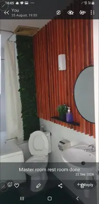a bathroom with a toilet and a sink and a mirror at Crystal Creek condo Taiping in Taiping