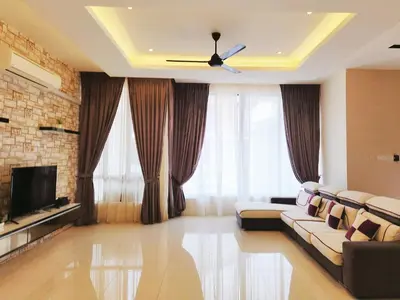a living room with a couch and a television at Botani Nadya 5B4B by verve 19 pax in Ipoh