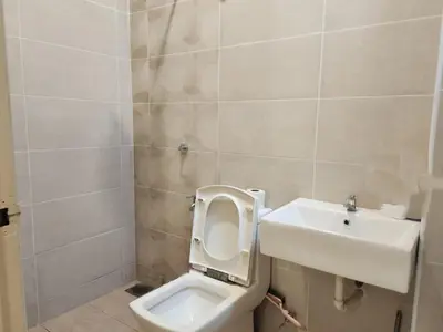 a bathroom with a toilet and a sink at Botani Nadya 5B4B by verve 19 pax in Ipoh