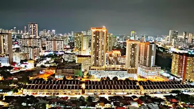 a view of a large city at night at relax family stay 3BR 10pax urban in Jelutong