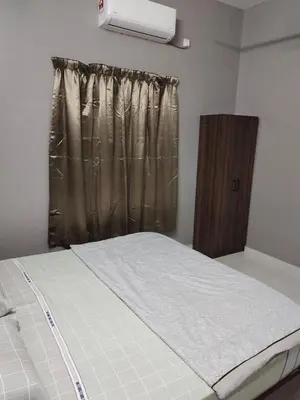 a bed in a room with a window and a bed at DeStay Taiping in Taiping