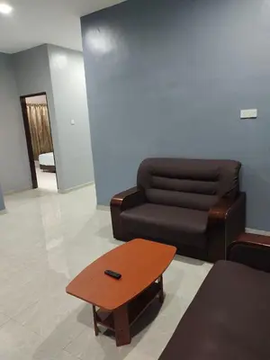a living room with a couch and a coffee table at DeStay Taiping in Taiping