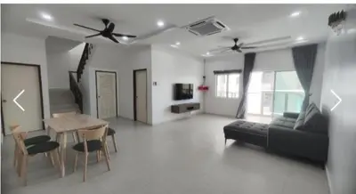 a living room with a couch and a table at Sekinchan SeaView Garden 20pax 6R6B HighView in Sekincan