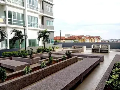 a courtyard with benches in front of a building at Sekinchan SeaView Garden 20pax 6R6B HighView in Sekincan