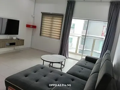 a living room with a couch and a table at Sekinchan SeaView Garden 20pax 6R6B HighView in Sekincan