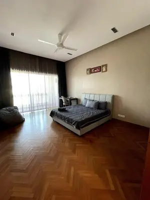 a bedroom with a bed and a wooden floor at Marina Suite with Seafront Sunrise View in George Town