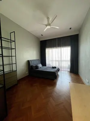 a bedroom with a bed and a ceiling fan at Marina Suite with Seafront Sunrise View in George Town