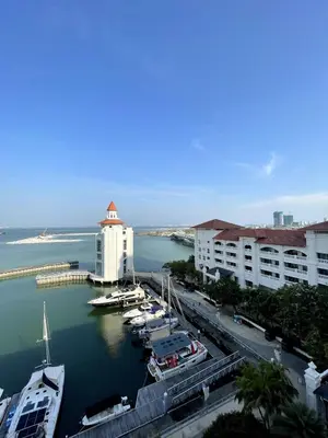 a view of a marina with boats in the water at Marina Suite with Seafront Sunrise View in George Town