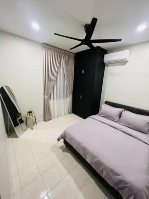 a bedroom with a bed and a ceiling fan at Cozy Stay Bertam in Kepala Batas