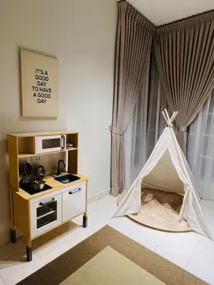 a childs play room with a pretend play tent at Cozy Stay Bertam in Kepala Batas