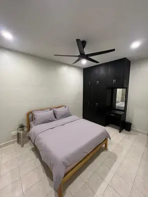 a bedroom with a bed with a ceiling fan at Cozy Stay Bertam in Kepala Batas
