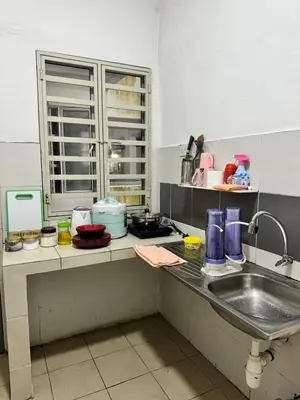 a kitchen with a sink and a counter top at AYAAN BLOOM BUDGET HOMESTAY FREE WiFi & Netflix in Cameron Highlands
