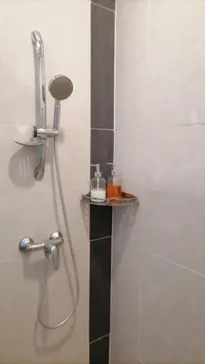 a shower in a bathroom with a shower head at Nova Highlands Hilltop Retreat Cameron Highlands in Brinchang