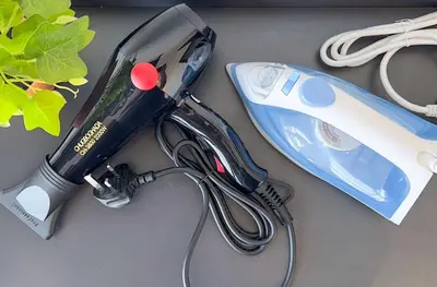 a hair dryer sitting on a table with a hair dryer at Panoramic Georgetown City & Sea View with Netflix in Jelutong