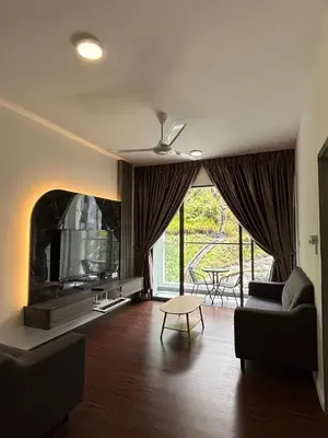 a living room with a couch and a tv at Ella Residence Homestay 2 in Brinchang