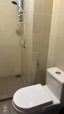 a bathroom with a shower and a toilet in it at Ella Residence Homestay 2 in Brinchang
