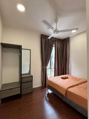 a bedroom with a bed and a ceiling fan at Ella Residence Homestay 2 in Brinchang