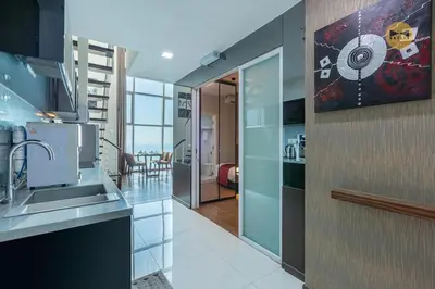 a kitchen with a sink and a counter top at Seaview Seafront Duplex in Town with WiFi & Full Kitchen 23 in George Town