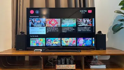 a flat screen tv sitting on top of a table at Seaview Seafront Duplex in Town with WiFi & Full Kitchen 16 in George Town
