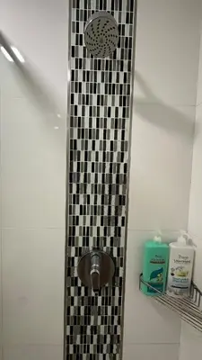 a shower with a black and white checkered tile at Seaview Seafront Duplex in Town with WiFi & Full Kitchen 16 in George Town