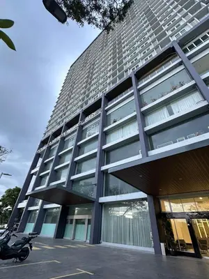 a building with a motorcycle parked in front of it at ICC Luxury Suites Ipoh City Centre By Landmark in Ipoh
