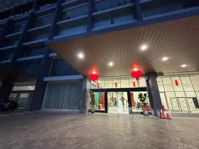 a large building with red lights in front of it at ICC Luxury Suites Ipoh City Centre By Landmark in Ipoh