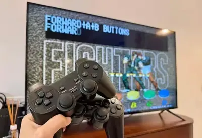 a person holding two video game controllers in front of a tv at Brickyard at 6 in Ipoh